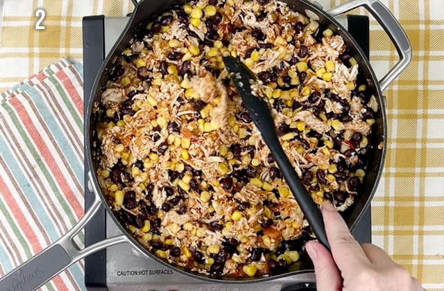 Cooking mexican chicken casserole in a large skillet
