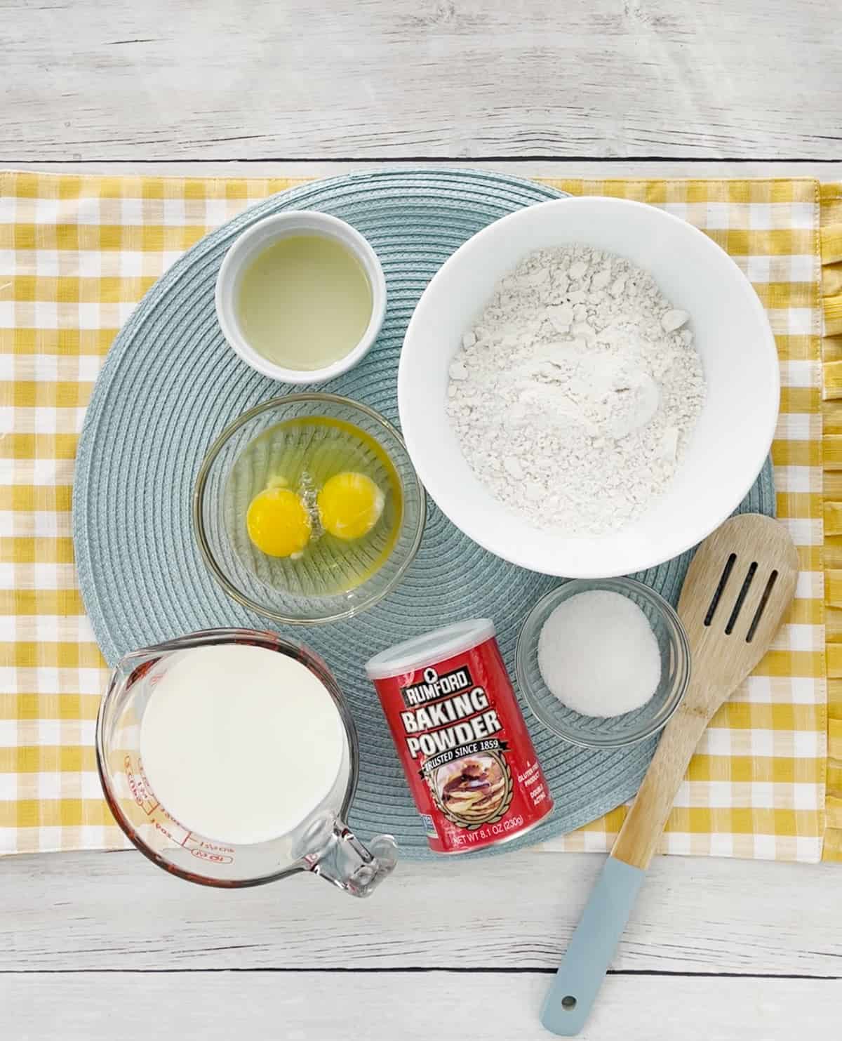 Ingredients for homemade pancakes on a circle placemat.