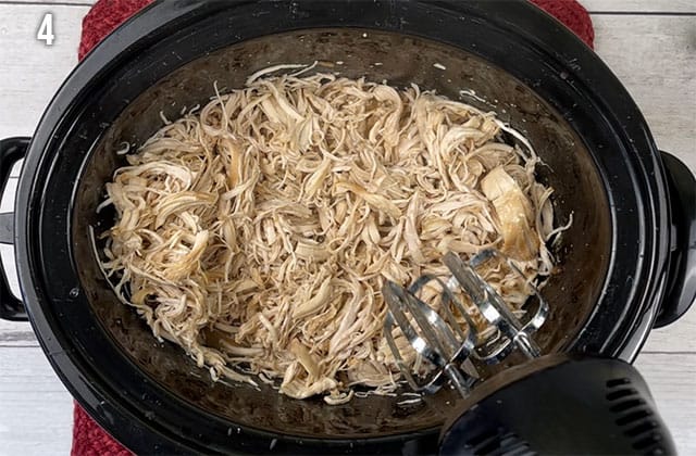 Shredding chicken in a Crockpot with a hand mixer