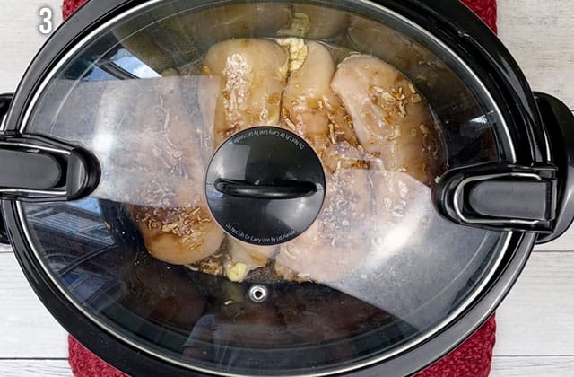 Chicken breasts in a Crockpot with the lid on