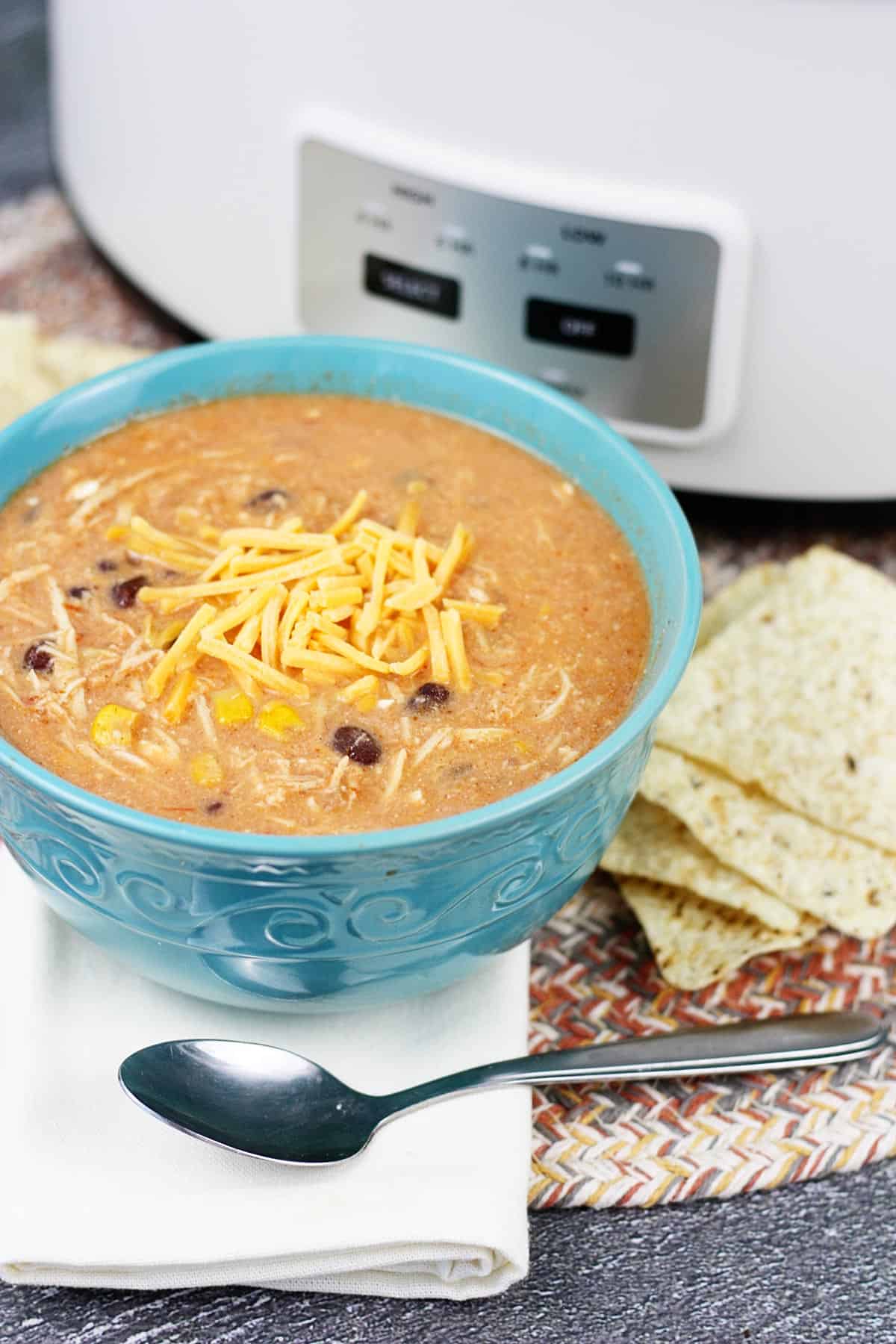 Crockpot chicken taco soup in a blue bowl.