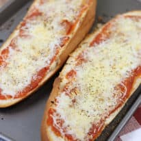 French bread pizza on a baking sheet