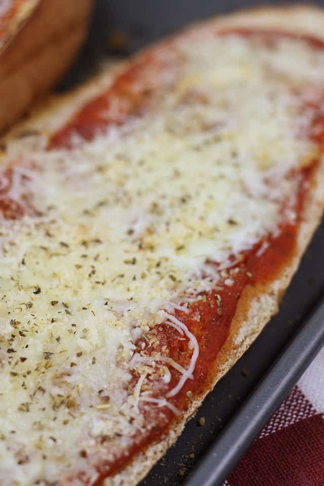 French bread pizza on a cooking sheet