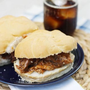 Root beer pulled pork sandwiches on a blue plate