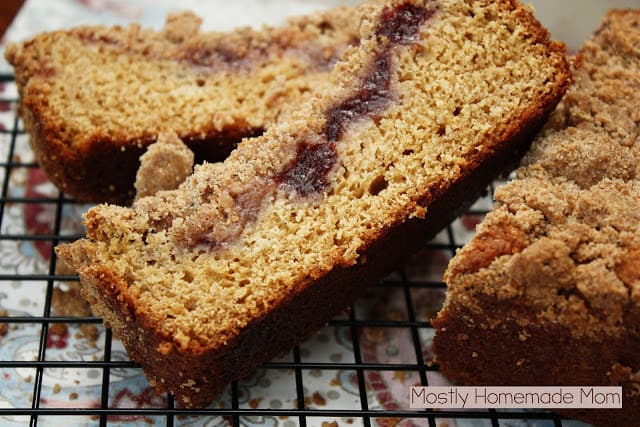 Slices of cranberry coffee cake on a cooling rack.