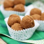Irish Potato Candy in paper muffin liners on a green napkin
