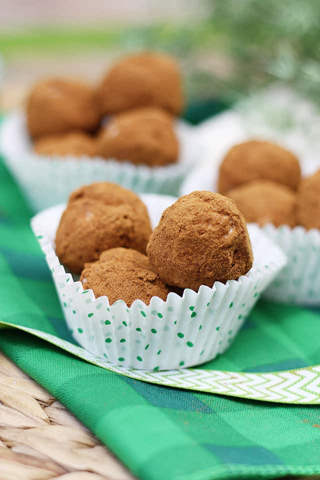 Irish Potato Candy in paper muffin liners on a green napkin
