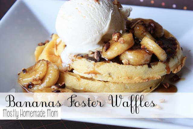 A plate of bananas foster waffles with ice cream on top.