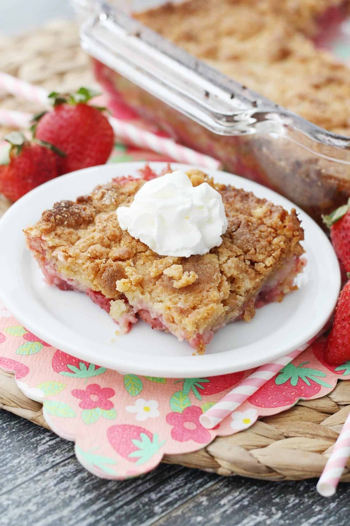 A slice of strawberry cobbler on a white plate.
