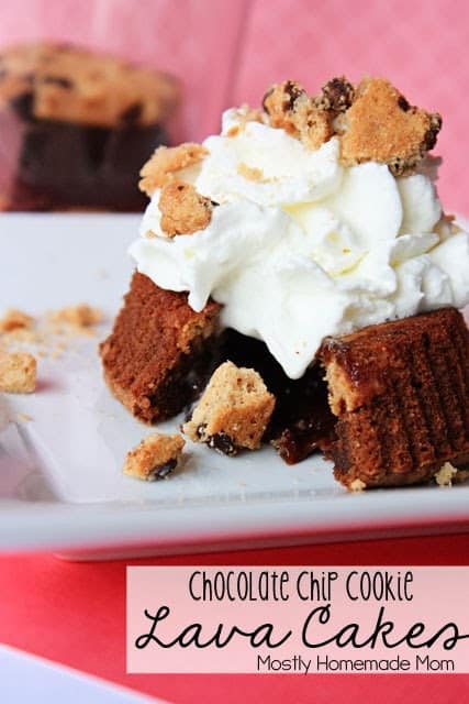 A chocolate chip cookie lava cake with whipped cream on a plate.