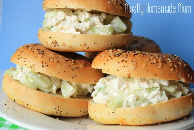 A stack of three cucumber bagel sandwiches.