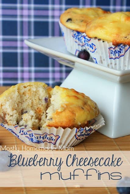 A blueberry cheesecake muffin broken in half.