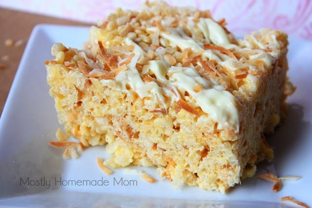 A coconut rice krispie treat topped with toasted coconut.