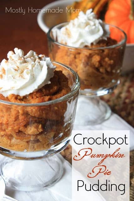 Pumpkin pudding in glass dishes with whipped cream.