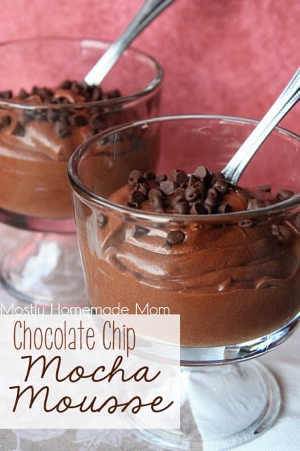 Mocha mousse in glass dessert dishes with spoons.