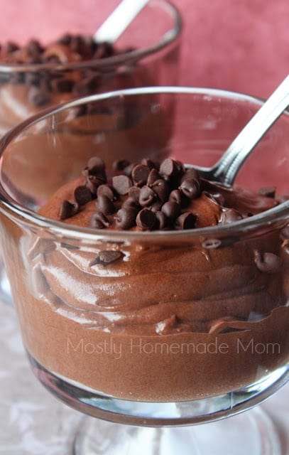 Mocha mousse in a glass dish with chocolate chips on top.