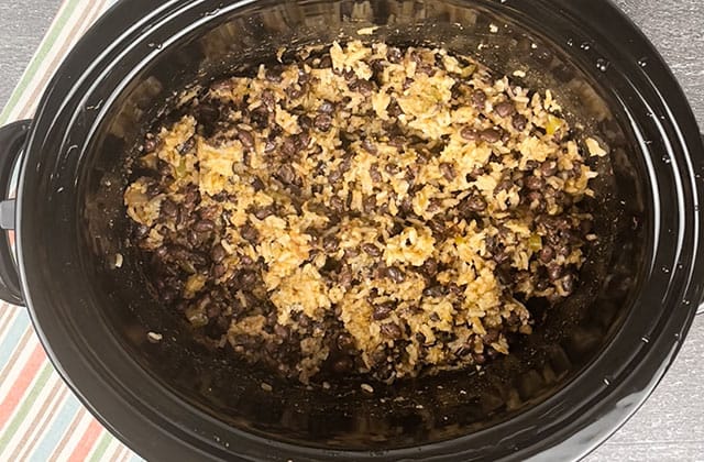 Finished crockpot black beans and rice in a slow cooker