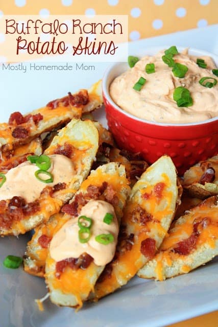 Buffalo potato skins topped with ranch sauce and green onion slices