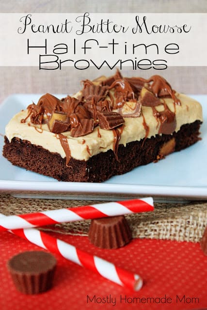 A peanut butter mousse brownie on a white plate topped with peanut butter cups