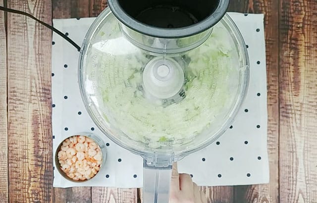 Onion and celery in a food processor