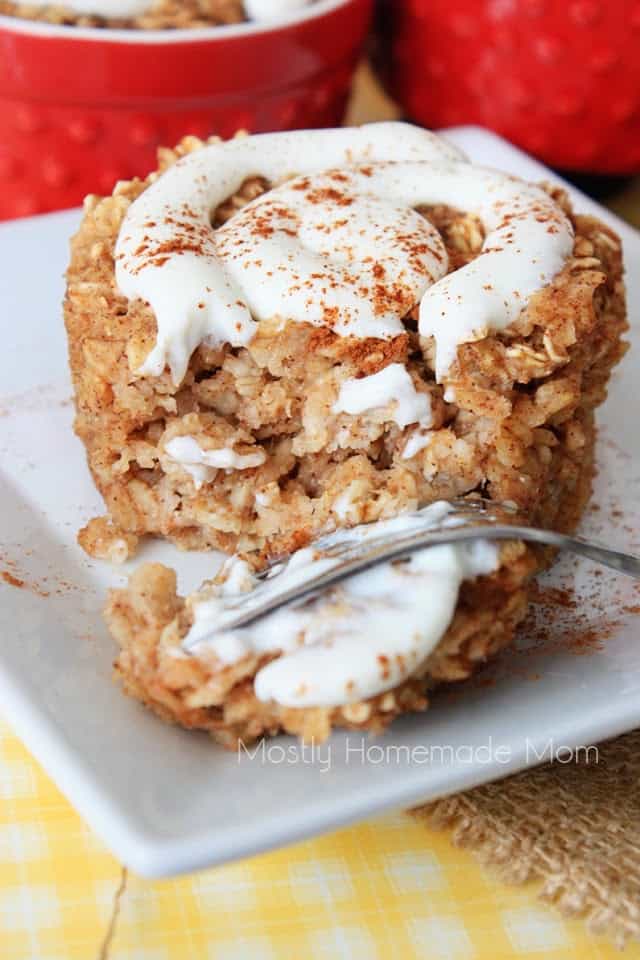 A fork taking a piece of a cinnamon roll oatmeal with frosting