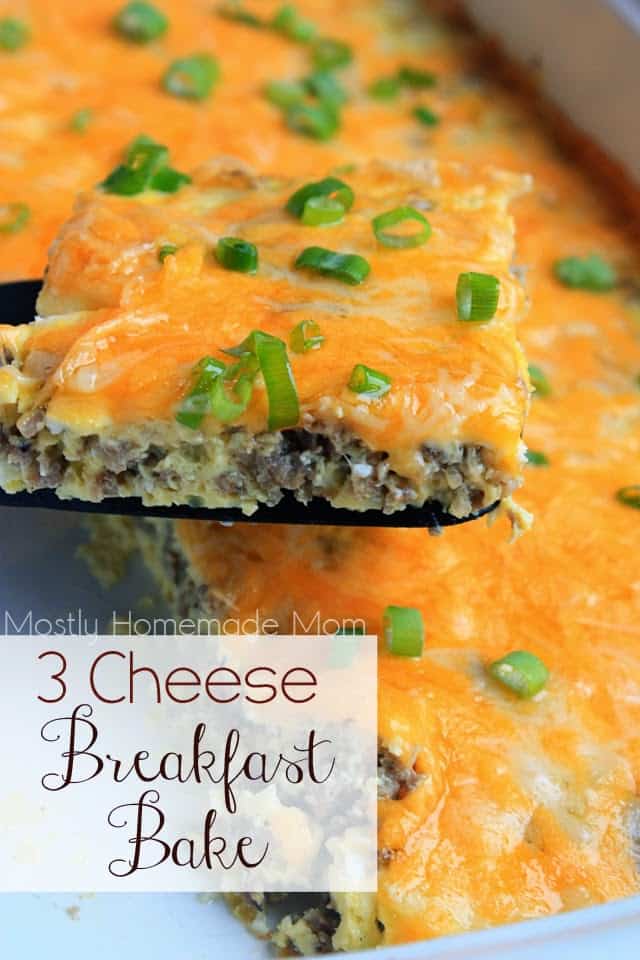 Cheesy breakfast casserole with a spatula taking a slice out of it