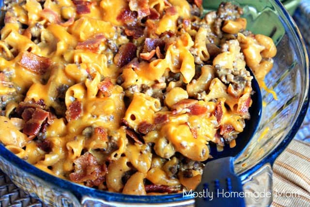 Bacon cheeseburger mac and cheese in a glass baking dish with melted cheese on top