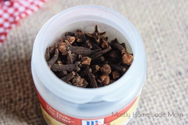 A spice jar filled with whole cloves