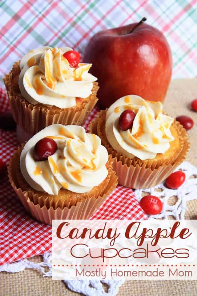 Apple cupcakes with cinnamon frosting and topped with a drizzle of caramel on a red plaid napkin
