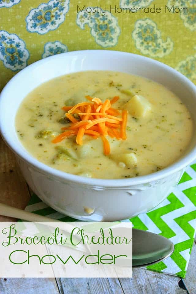 A bowl of broccoli cheddar chowder next to a white handled spoon
