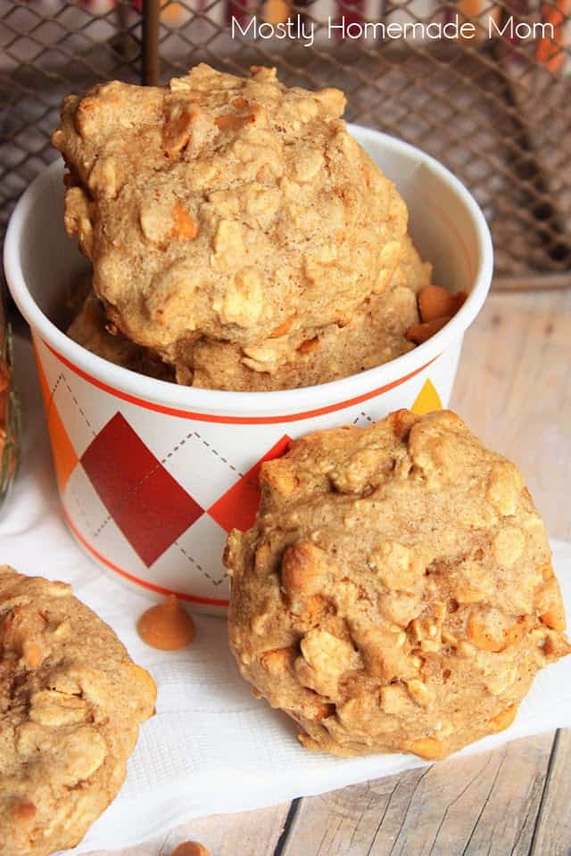 A stack of oatmeal butterscotch cookies in a paper party cup