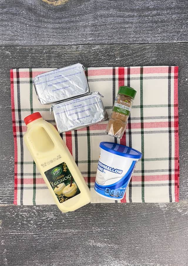 Ingredients for eggnog dip on a plaid placemat