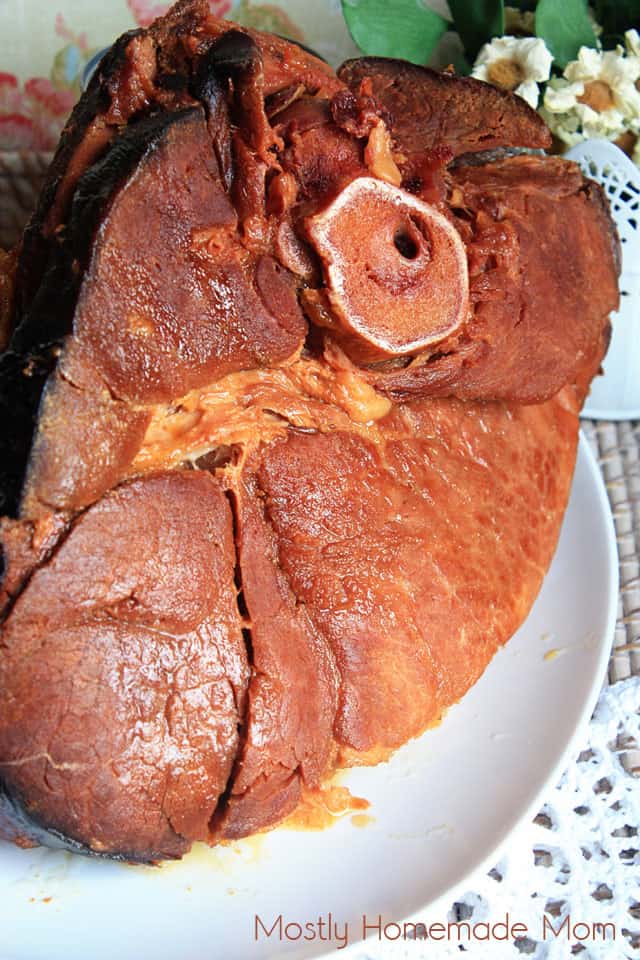 Crockpot brown sugar ham with glaze on a white platter