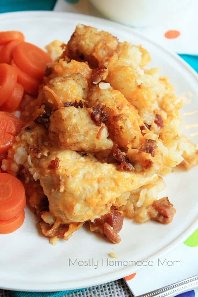 A close up picture of chicken tater tot casserole on a white plate