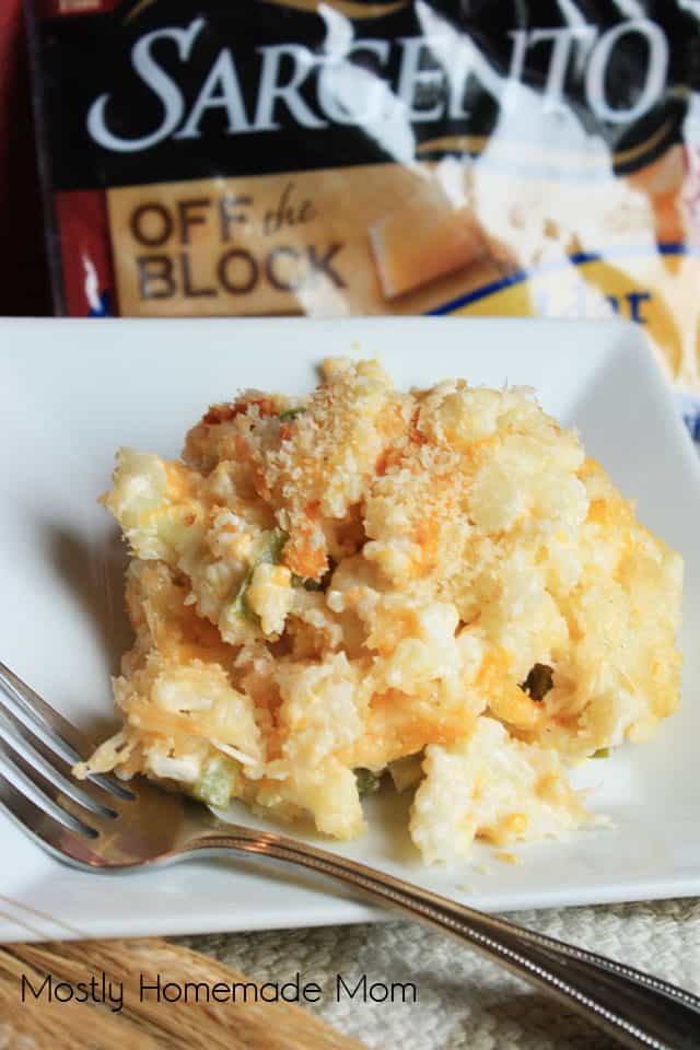 Finished cauliflower casserole on a white plate with a fork