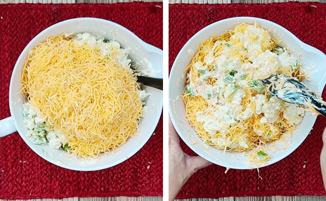 Adding in shredded cheddar cheese to a white mixing bowl