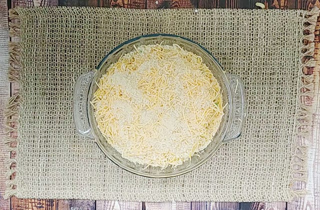 Chicken mac and cheese in a baking dish with bread crumb topping