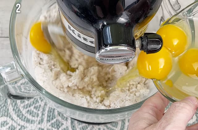 Mixing peach cobbler bread ingredients into a stand mixer
