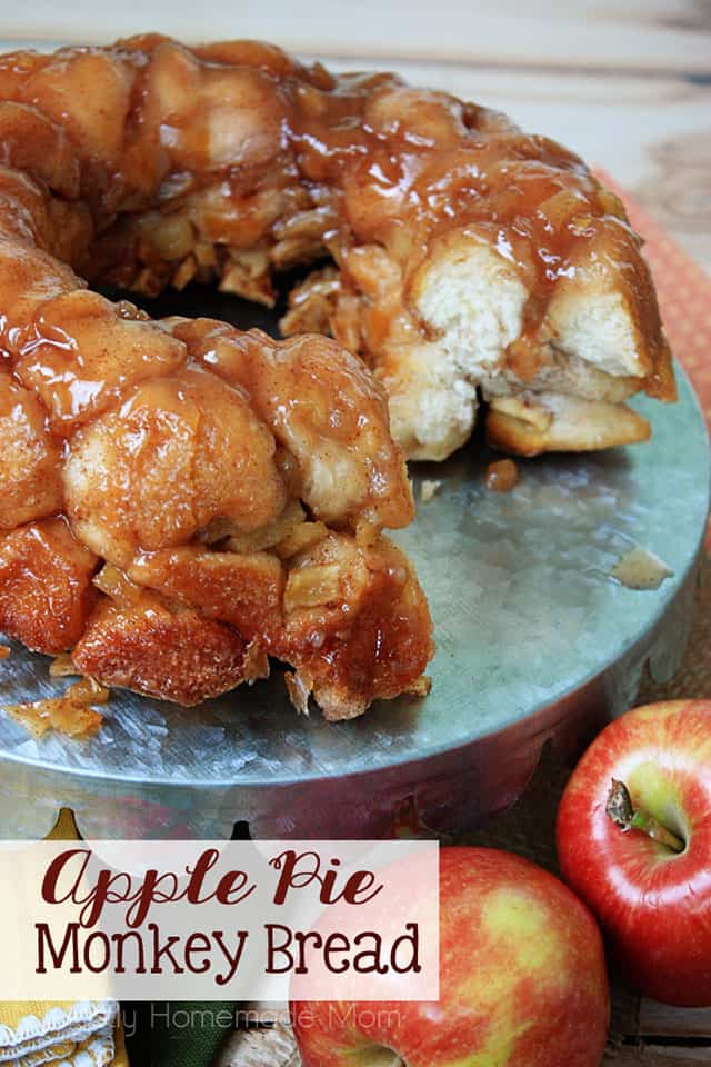 Apple Pie Monkey Bread on a serving platter next to fresh apples