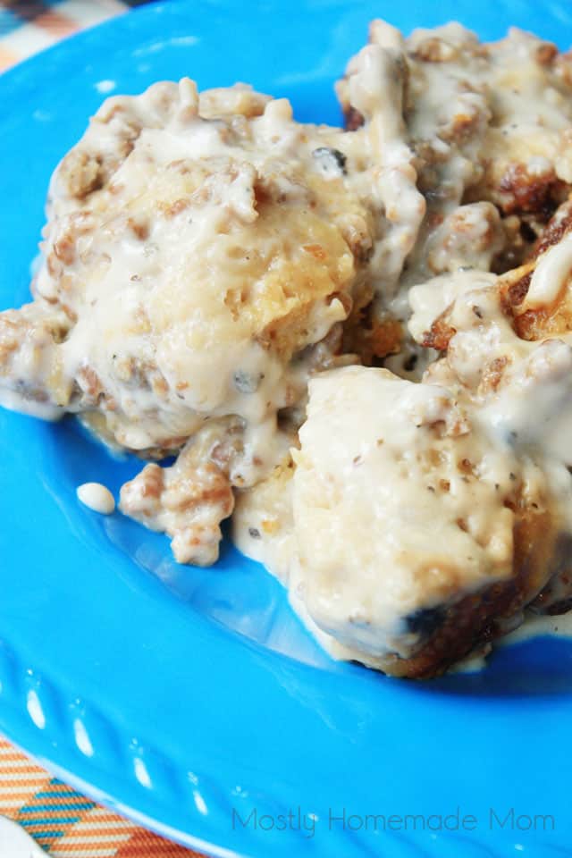 A serving of crockpot biscuits and gravy on a blue plate