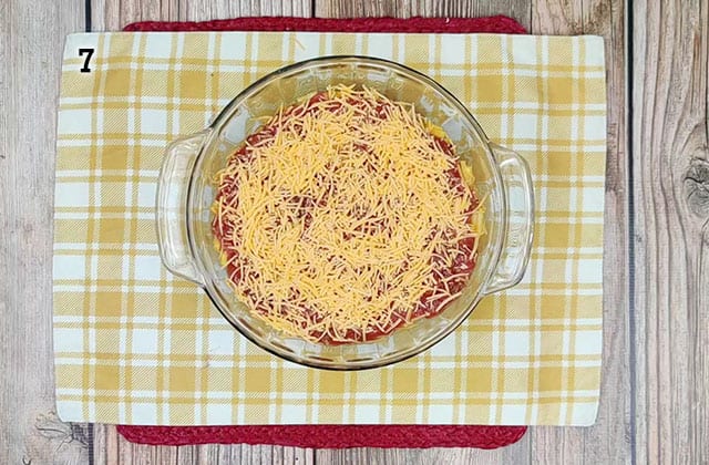Shredded cheese over top of taco mac casserole