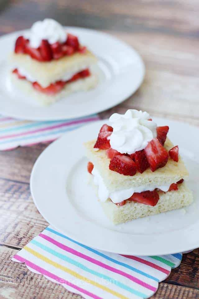 Two plates of strawberry shortcake slices