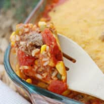 Stuffed pepper casserole being scooped up with a spoon.