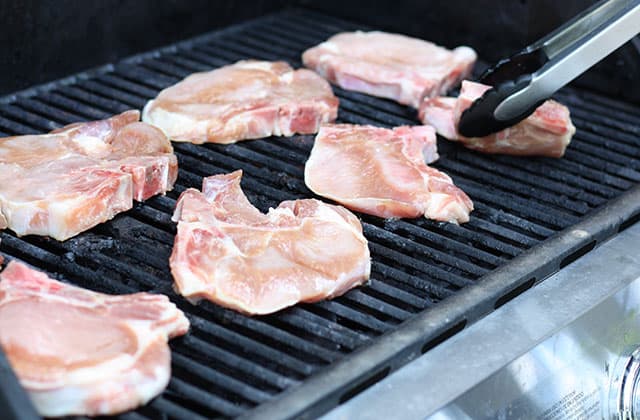 Bone in pork chops on an outdoor gas grill