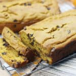 Chocolate chip pumpkin bread loaves sliced on a wire rack