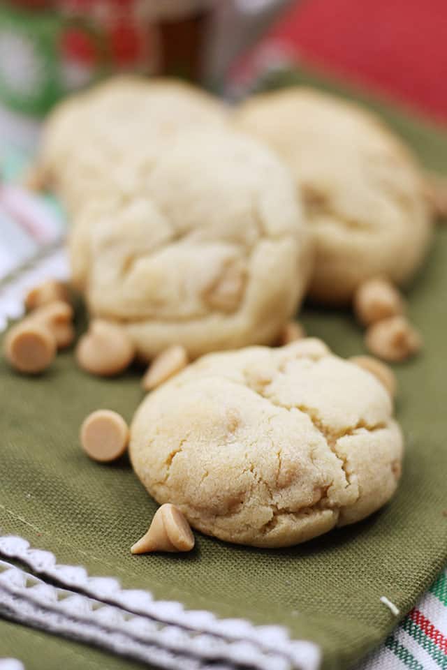 A close up of peanut butter chip cookies on a green napkin