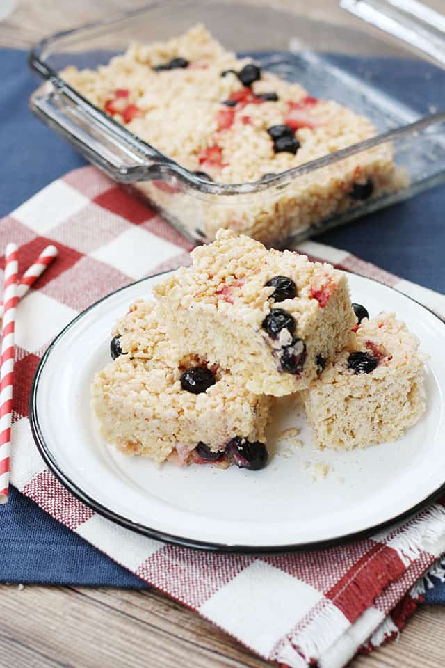 Berry cheesecake rice krispie treats on a white plate